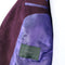 Close-up of a purple jacket with a green label reading 'Donnelly' on a white background