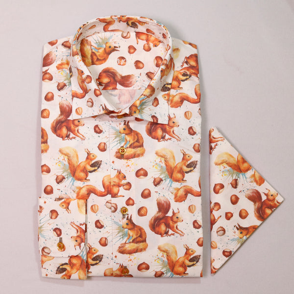 Folded shirt with squirrel and nut pattern on a light gray background