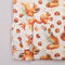 squirrel and acorn pattern on a light background.