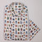Shirt with colorful beetle pattern on a light gray background