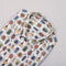 Folded shirt with colourful beetle pattern on a white background