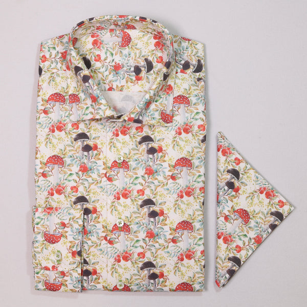 Floral patterned shirt with matching pocket square on a light gray background