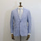 Light blue suit jacket on a mannequin against a plain background